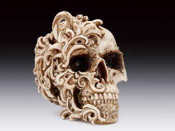 SKULL WITH SWIRLY ORNAMENTS